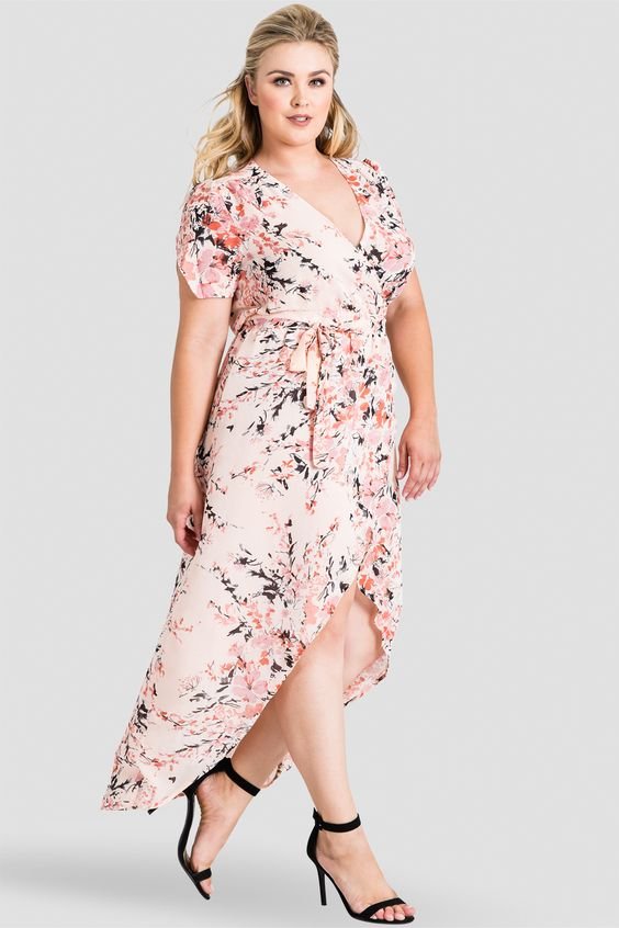 Plus Size Robin Short Sleeve V-Neck Peach Pink Floral Print Maxi Dress -  This gorgeous plus size wrap maxi dress is both comfortable and versatile for nearly any occasion. The pattern is a unique abstract Japanese blossom floral print. The peach / rose wrap dress has short sleeves with flattering splits for a petal effect. It accentuates your waist with a waist tie, creating a flattering silhouette. The tulip bottom of this chiffon dress slightly opens at the knee for a more coquettish style. 