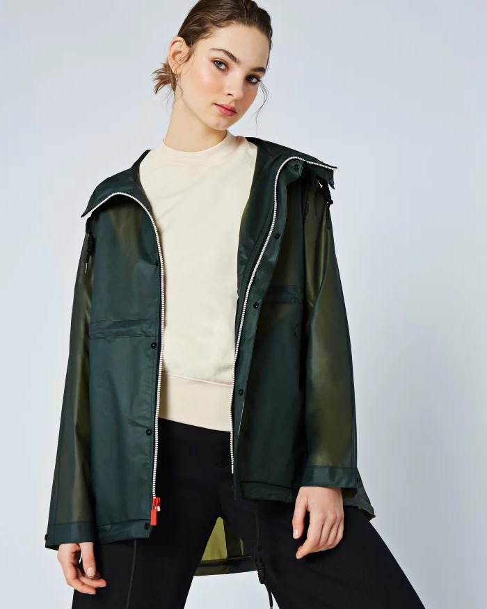 Women's Olive Green Hunter Waterproof Vinyl Smock Rain Jacket. Women's Hooded Olive Green Vinyl Rain Jacket. Fashioned in a stylish white waterproof vinyl, this olive green rain jacket with Hood for women.